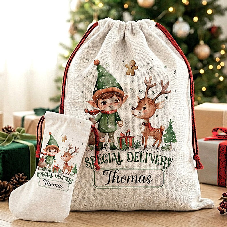 Personalized Christmas-themed canvas drawstring sack and matching stocking with an illustrated elf, reindeer, and the text 'SPECIAL DELIVERY Thomas' in a festive holiday setting.