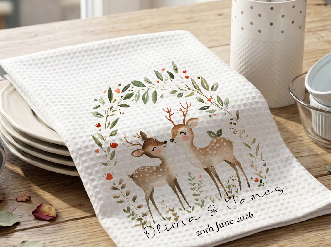 Personalized towel with deer design and text on a wooden table