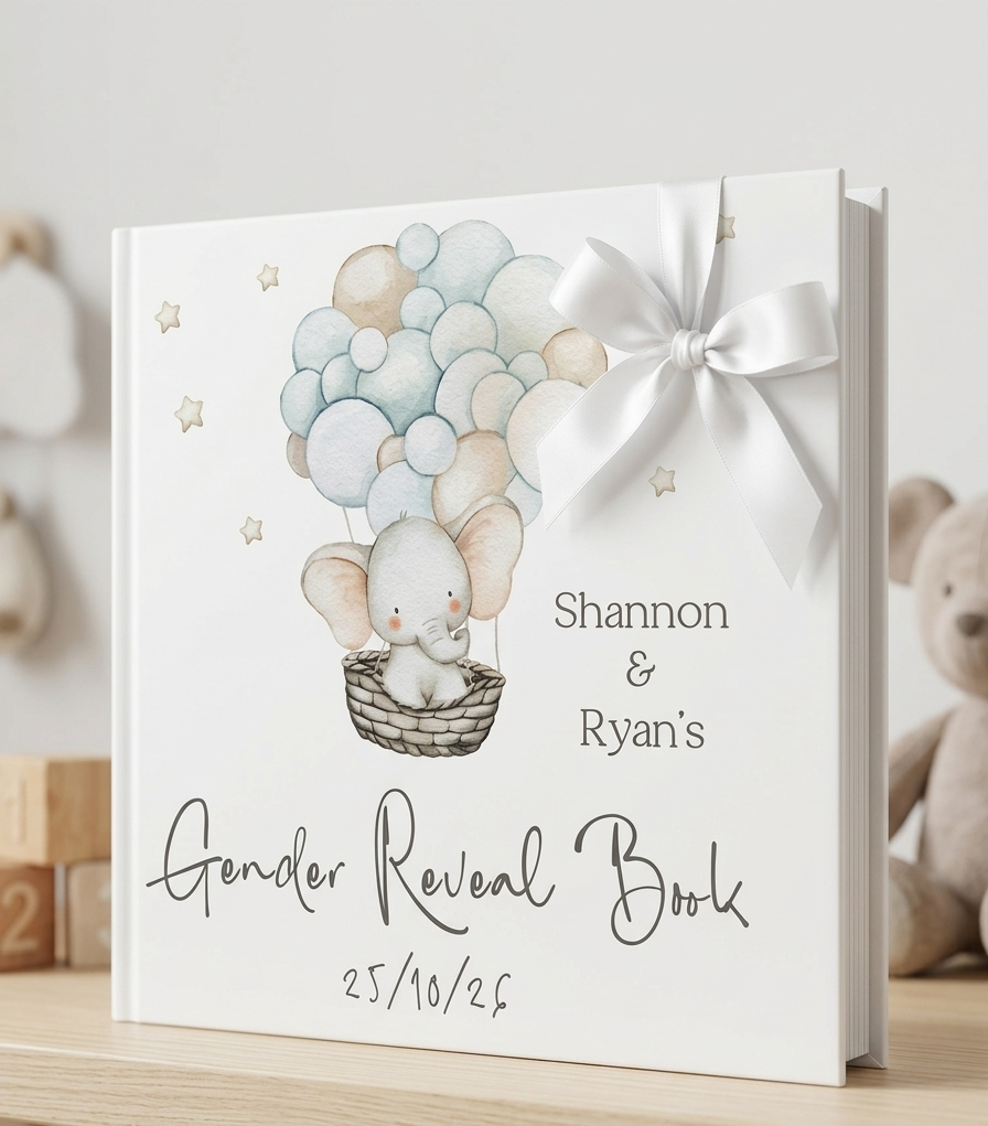 A personalized hardcover gender reveal book with a white bow, featuring an illustration of a baby elephant in a hot air balloon and the text 'Shannon & Ryan's Gender Reveal Book' on a light wood shelf.