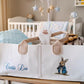 A personalized canvas baby storage tote bag with Beatrix Potter bunny illustration and the name 'Curtis Lee' embroidered in blue, filled with baby items in a nursery setting.