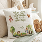 A square white throw pillow with embroidered-style bunny illustrations and a cozy bedtime message, styled on a bed with teddy bears and soft bedding.